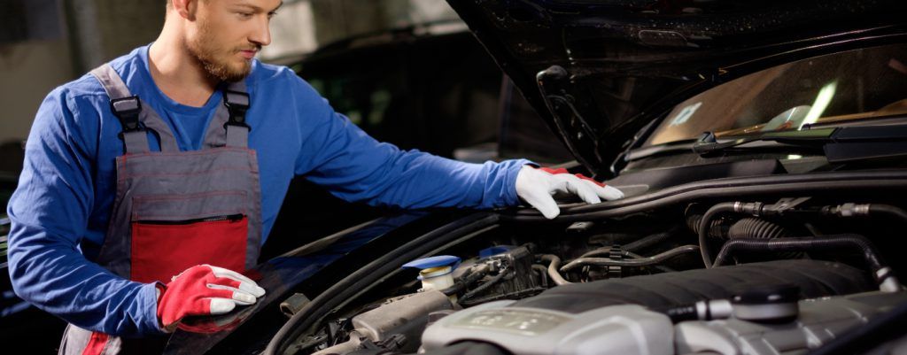 Mechanic looking under the bonnet - Car MOT Bournemouth